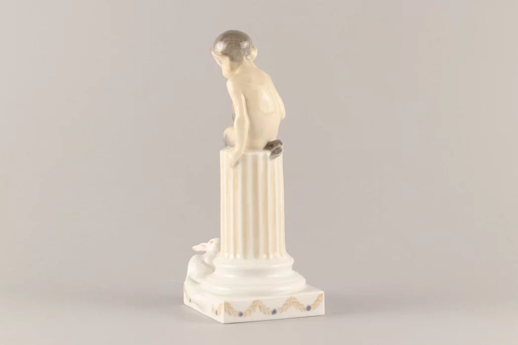 Figurine "Faun on a pedestal with a squirrel". Royal Copenhagen