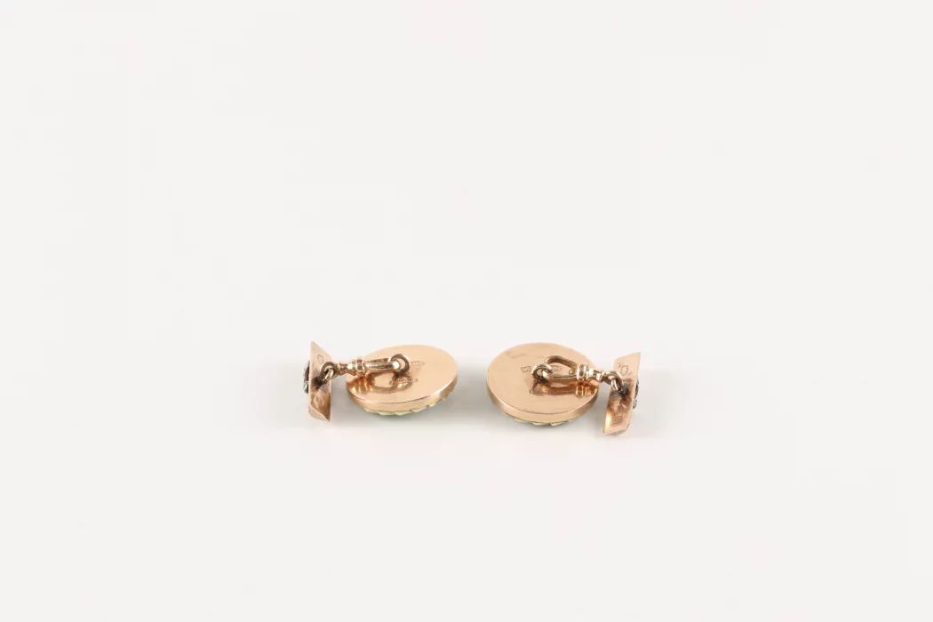 A pair of gold cufflinks