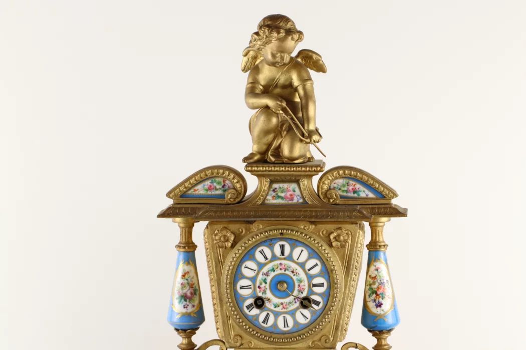 Pendule de cheminee de style Louis XIV