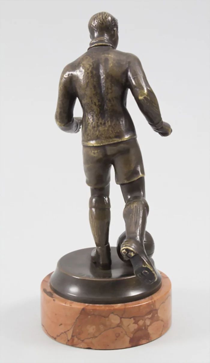 Football Player, bronze figure by Bruno Zach 1891-1945.