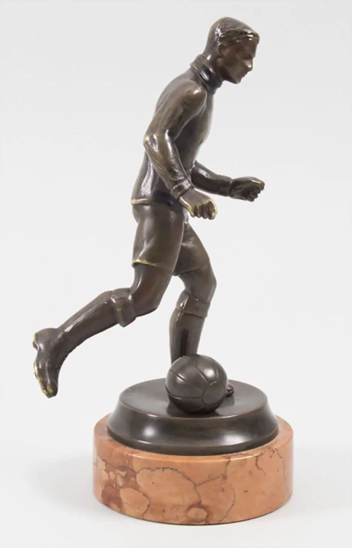 Football Player, bronze figure by Bruno Zach 1891-1945.