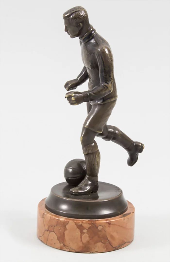 Football Player, bronze figure by Bruno Zach 1891-1945.