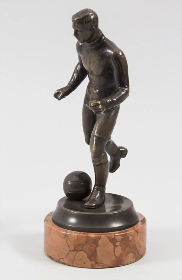 Football Player, bronze figure by Bruno Zach 1891-1945.