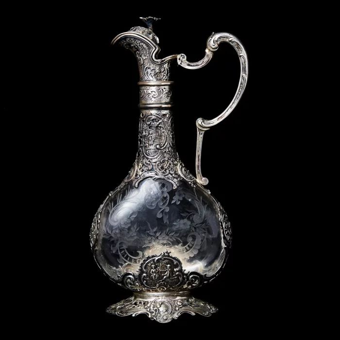 Silver decanter with glass.