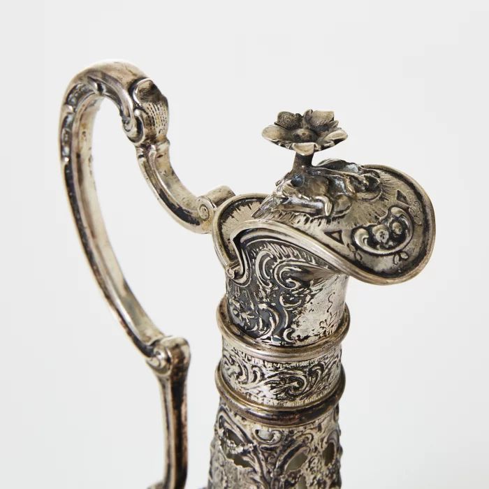 Silver decanter with glass.