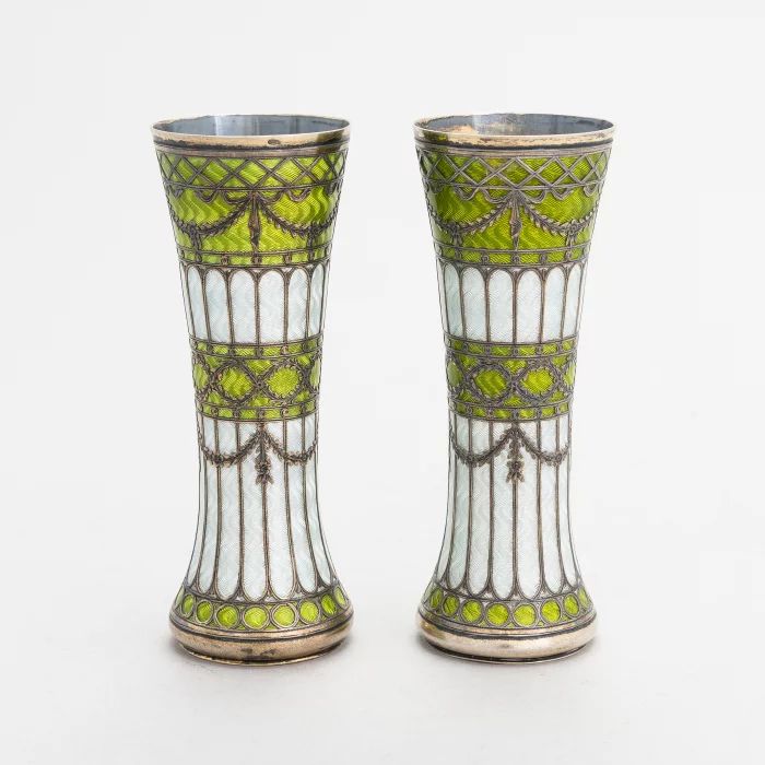 A pair of vases-buds of gilded silver and guilloché enamel, early 20th century. 