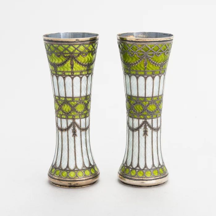 A pair of vases-buds of gilded silver and guilloche enamel, early 20th century. 