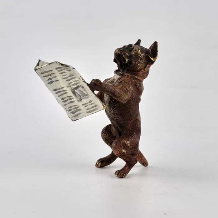 Vienna bronze miniature Dog with a newspaper. 