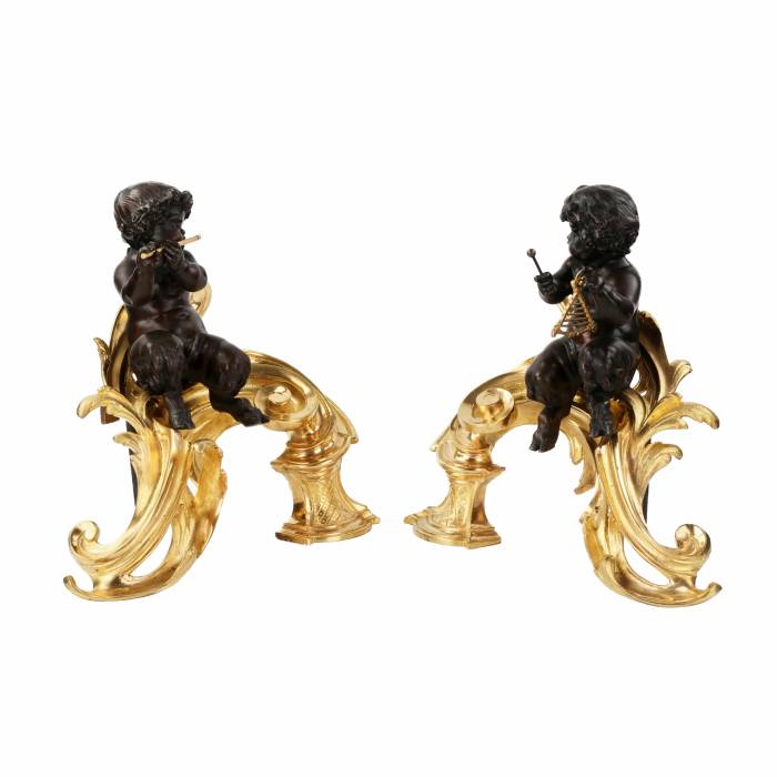 Pair of firewood cabinets in chiseled, gilded and patinated bronze in the Louis XV style. 