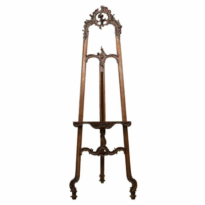 Carved, wooden easel of the turn of the 19th-20th centuries in neo-rococo style. 