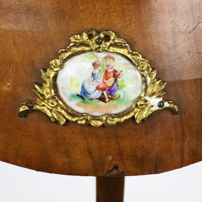 Console table with porcelain medallions and brass-bronze decor, third rococo style. 