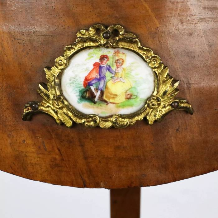 Console table with porcelain medallions and brass-bronze decor, third rococo style. 