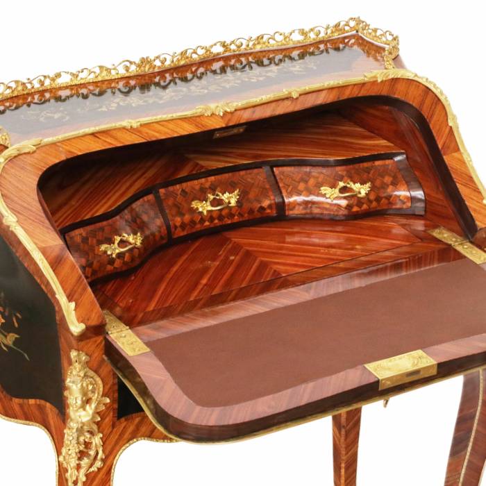 Coquettish ladies` bureau in wood and gilded bronze, Louis XV style. 