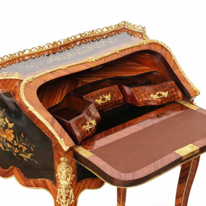 Coquettish ladies` bureau in wood and gilded bronze, Louis XV style. 