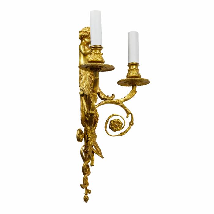 Four intricate gilded sconces with currency curls crowned with cherubs. 