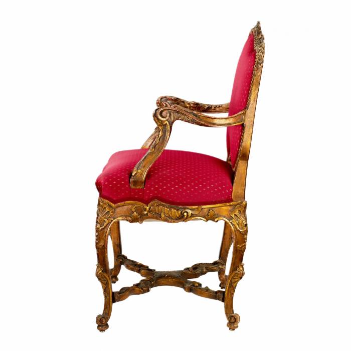 Magnificent, carved chair in the Rococo style of the 19th-20th centuries. 