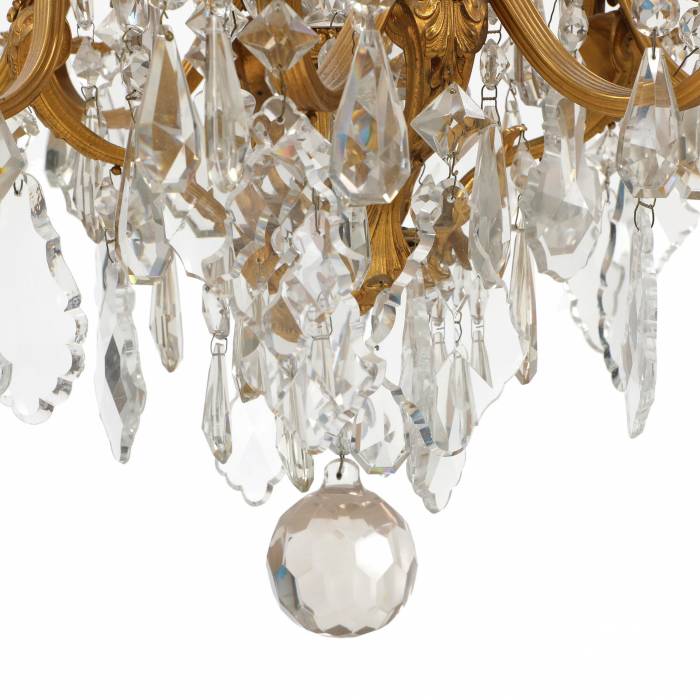 Chandelier in gilded bronze and crystal in neo-Rococo style with eight candles. France.1900 