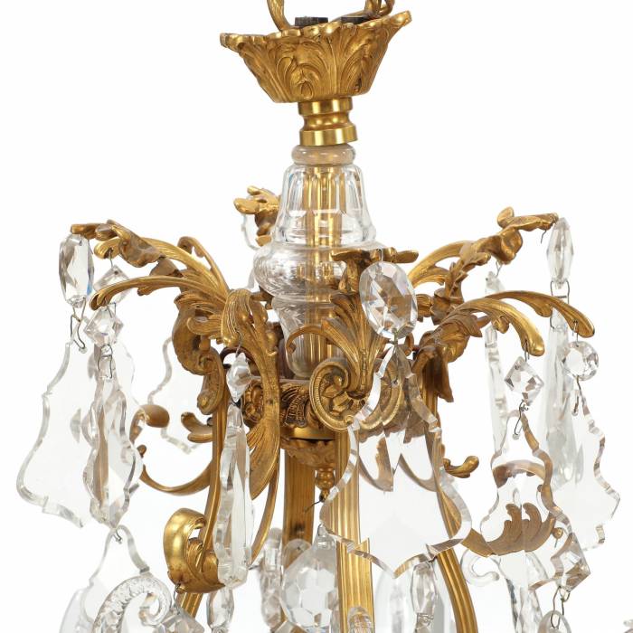 Chandelier in gilded bronze and crystal in neo-Rococo style with eight candles. France.1900 