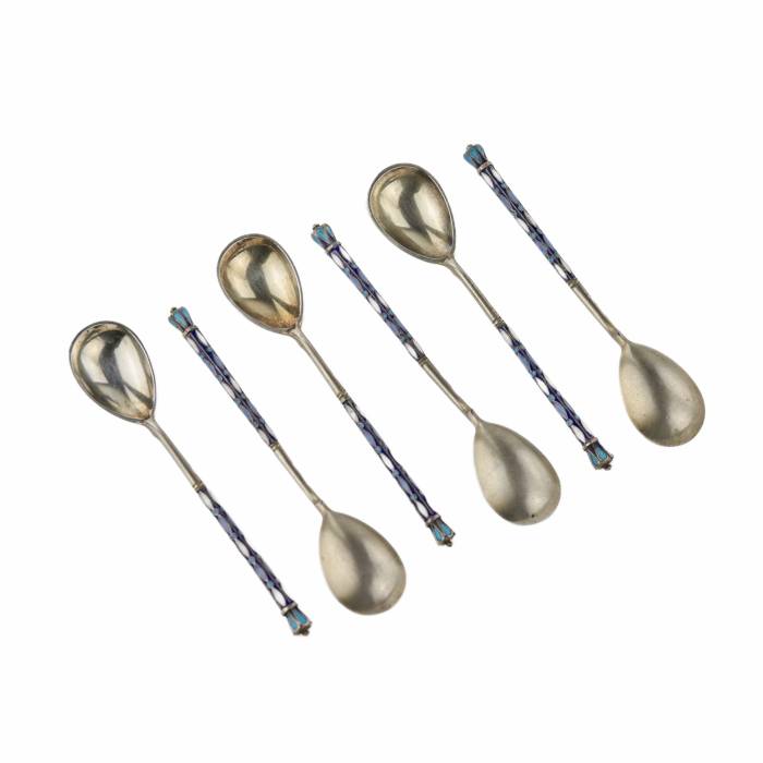 A set of teaspoons decorated with enamel in the original case. Moscow 1908-1917.