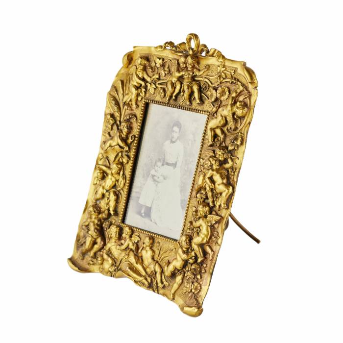 Non-trivial photo frame of gilded bronze in the Neo-Baroque style, the turn of the 19th-20th centuries. 