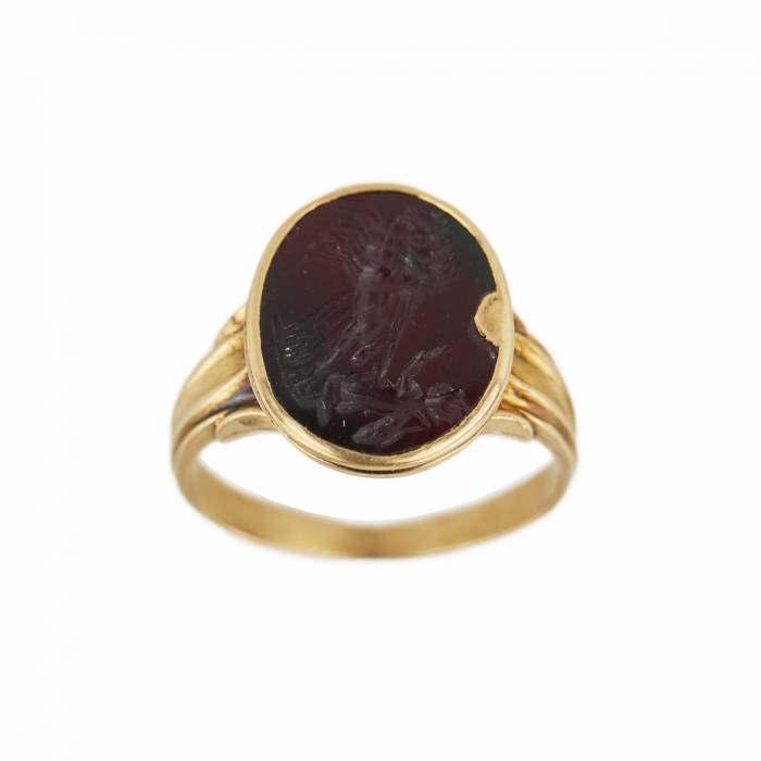 Antique 18K gold ring with red jasper gem, depicting Apollos chariot. Rome II-III centuries. AD