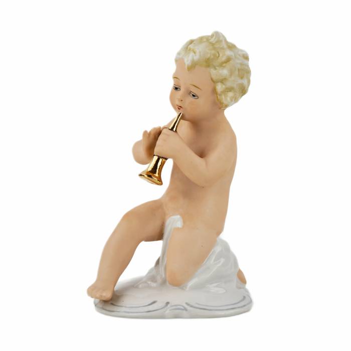 A figurine of a putti playing music on a pipe.