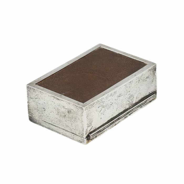 Wooden box upholstered with silver-plated metal. 20th century.