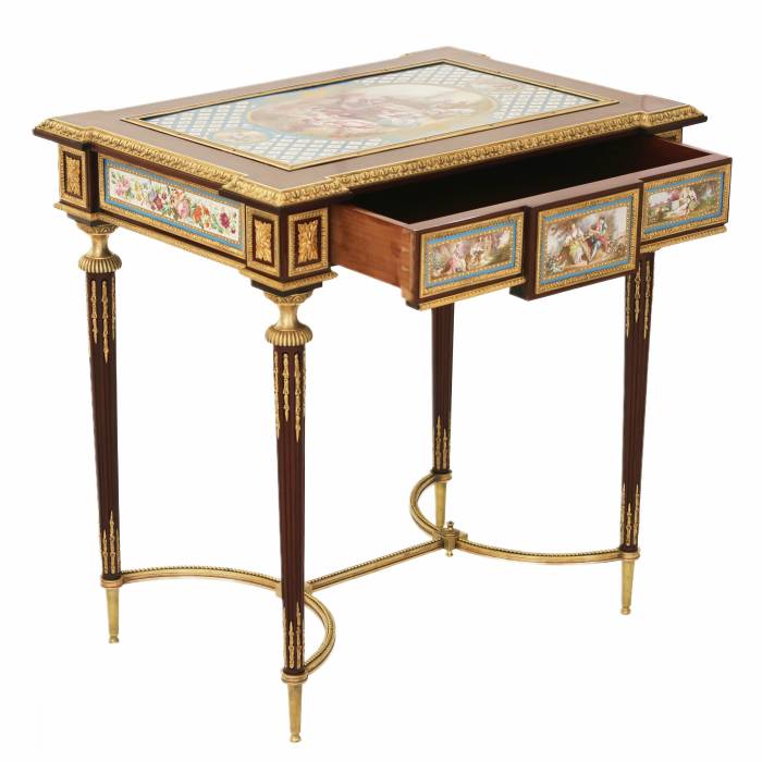 A magnificent ladies table with gilded bronze decor and porcelain panels in the style of Adam Weisweiler. France. 19th century 