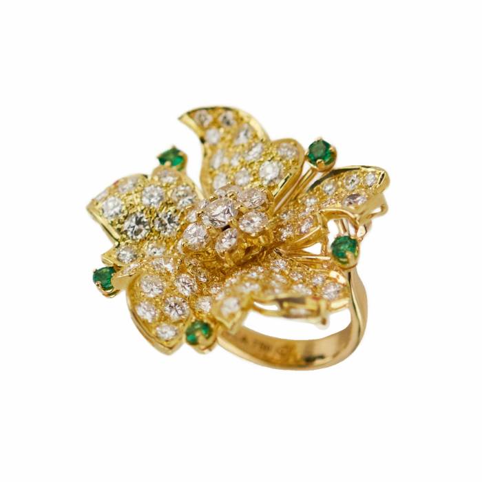 Gold 18K ring with seventy-seven diamonds and five emeralds. 