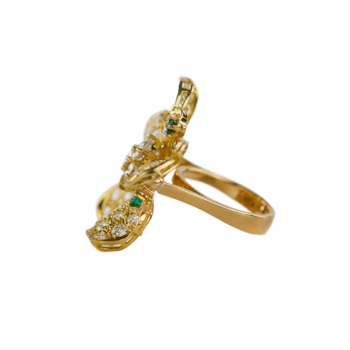 Gold 18K ring with seventy-seven diamonds and five emeralds. 