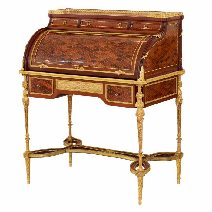 E.KAHN. A magnificent cylindrical bureau in mahogany and satin wood with gilt bronze. 
