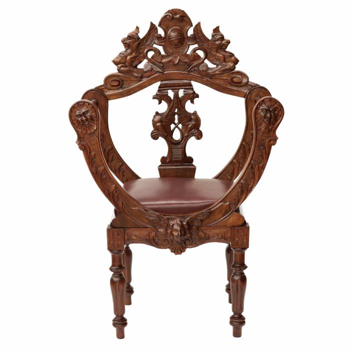 Carved, richly decorated walnut chair. 19th century