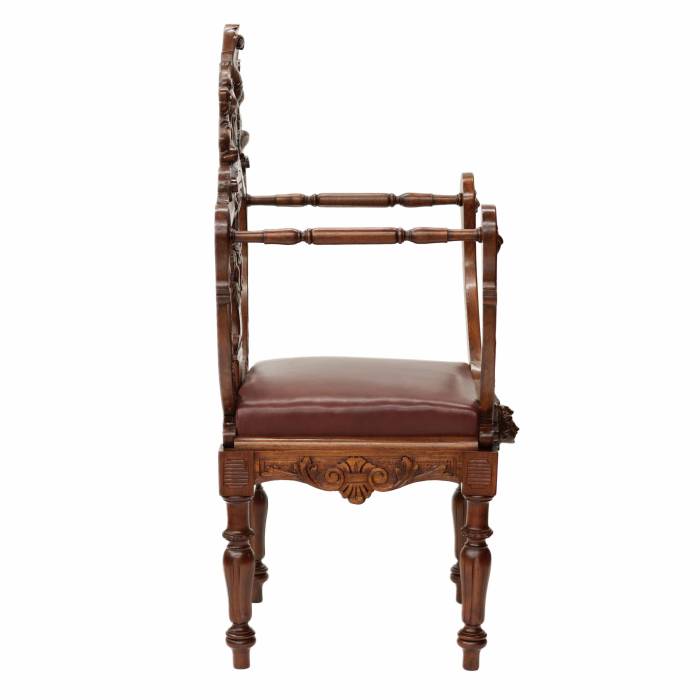Carved, richly decorated walnut chair. 19th century