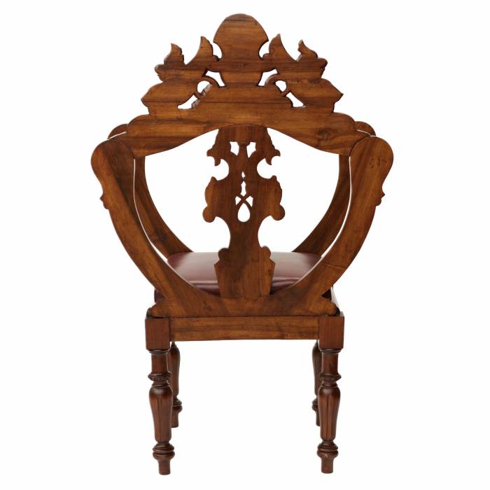 Carved, richly decorated walnut chair. 19th century