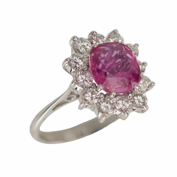 Gold ring with pink ruby and diamonds. 