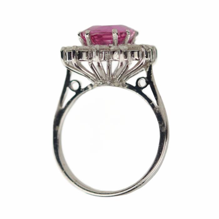 Gold ring with pink ruby and diamonds. 