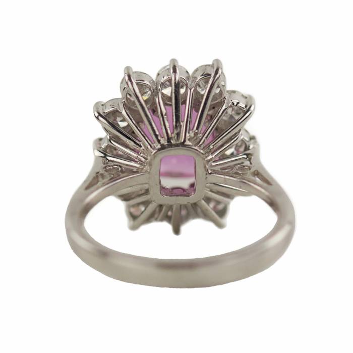 Gold ring with pink ruby and diamonds. 