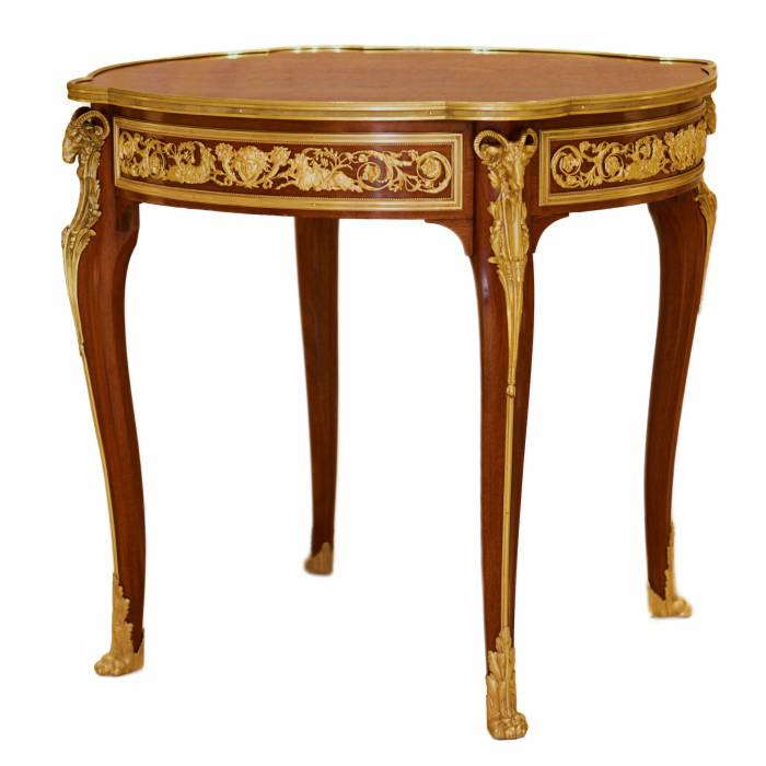 Mahogany table decorated with marquetry in the style of Louis XV, Francois Linke. Late 19th century 