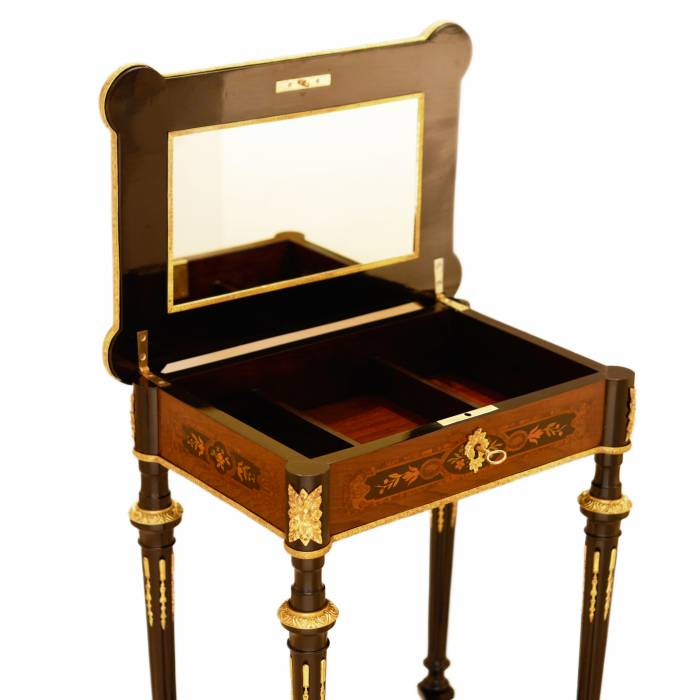 A lovely inlaid wood dressing table with gilded bronze. France late 19th century. 