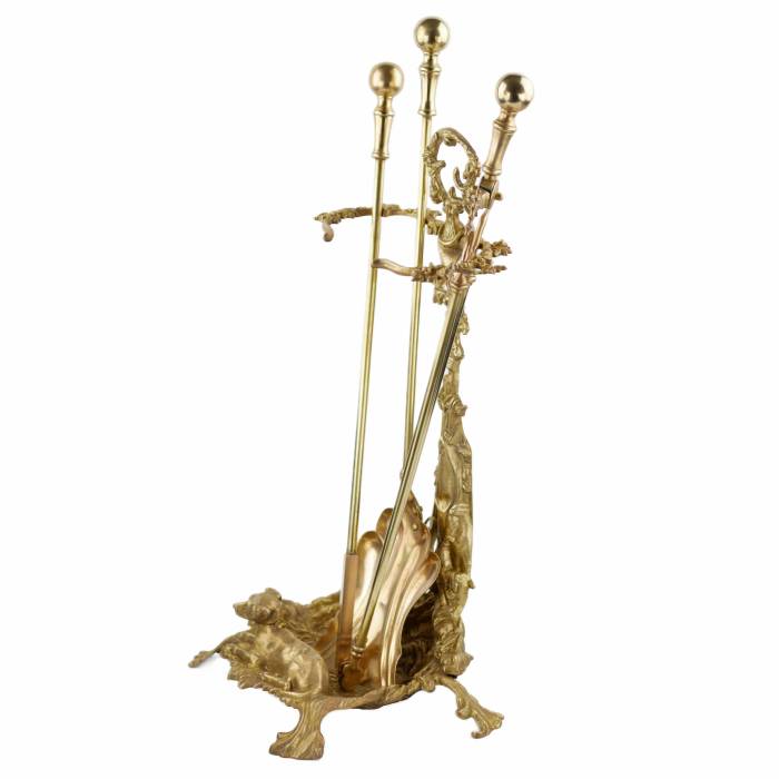 Brass-bronze fireplace set in historicist style. 19-20th centuries. 