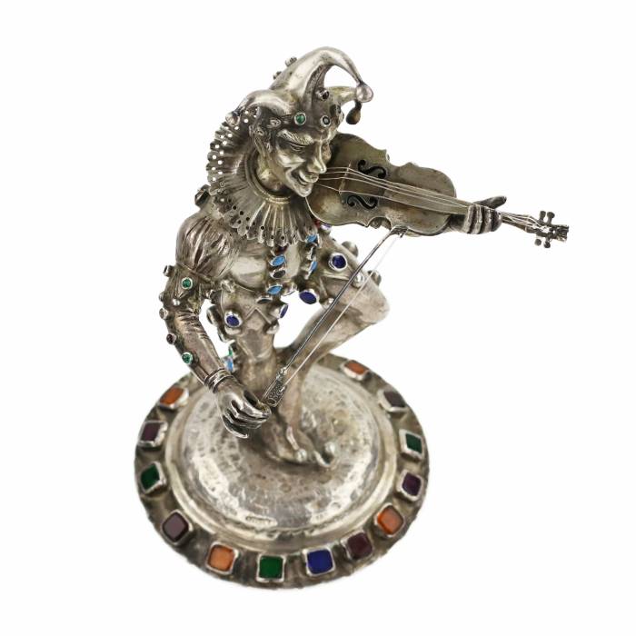 Figurine en argent d`un Arlequin jouant. Allemagne. 19ème siècle. 