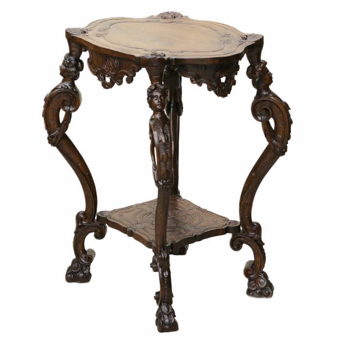 Carved wooden table in neo-Rococo style from the turn of the 19th century.