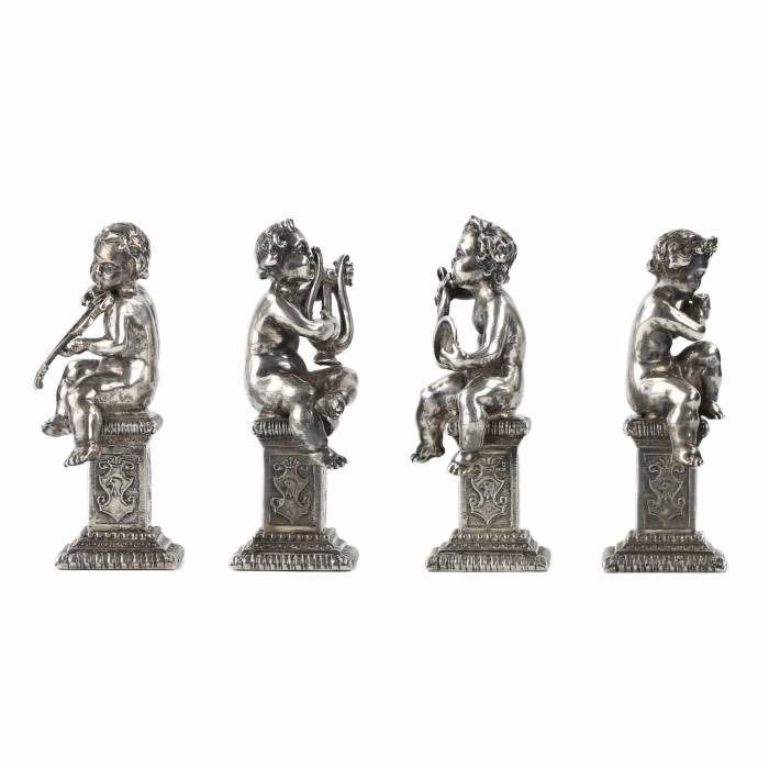 Four funny figures of putti musicians in silver. 