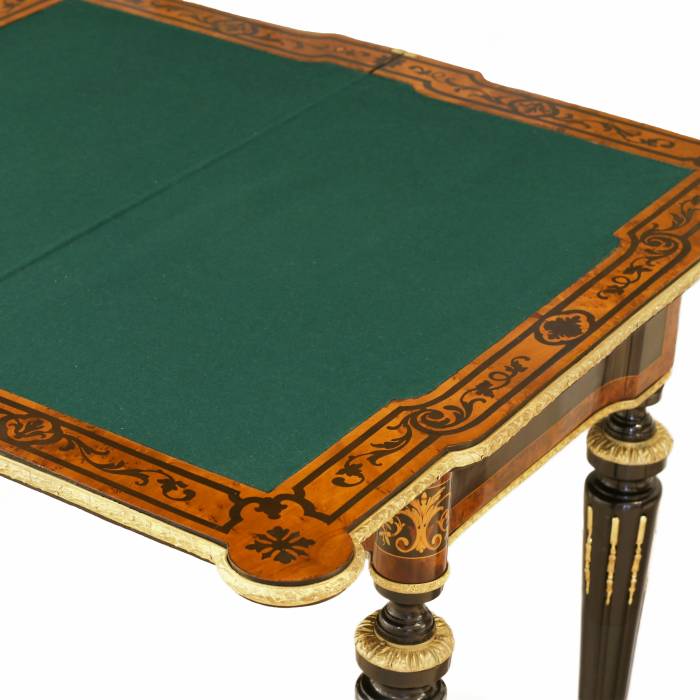 Gaming table decorated with a pattern using marquetry technique. France. Late 19th century 