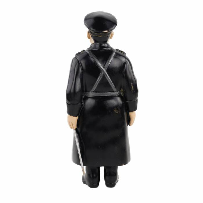 BRONZE FIGURINE OF A POLICEMAN, PAINTED WITH COLD ENAMELS AFTER A FABERGÉ MODEL RUSSIA, SAINT PETERSBURG, 1911