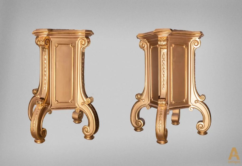 A couple of gold-plated pedestals