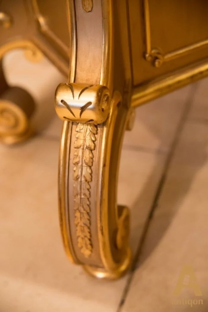 A couple of gold-plated pedestals