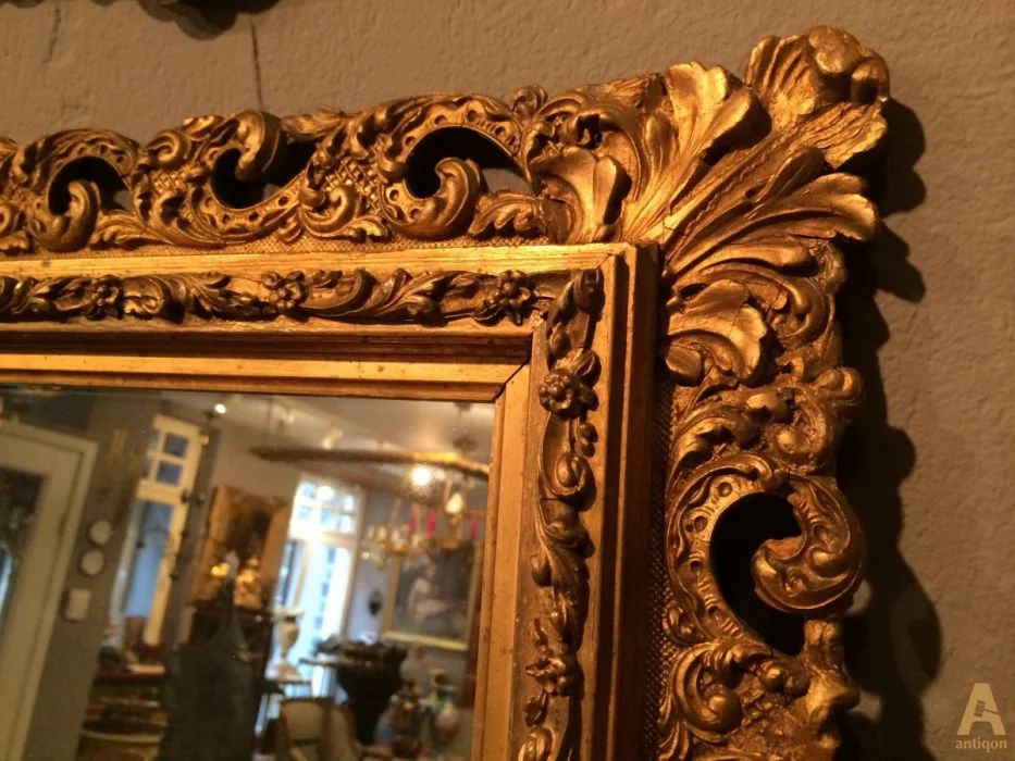 The mirror in a carved frame