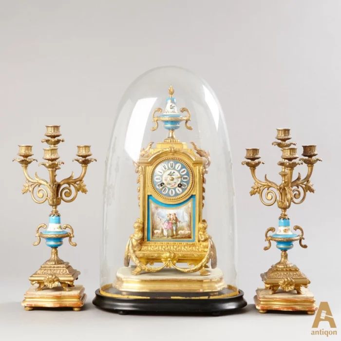 "Clock with candlesticks"