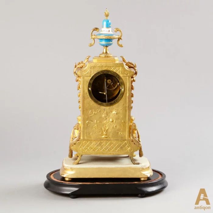 "Clock with candlesticks"